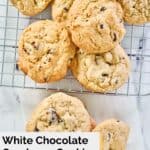 overhead view of white chocolate cranberry cookies on a wire rack.