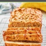 whole wheat banana nut bread on a wire rack and a banana.