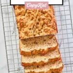 overhead view of whole wheat banana bread loaf on a wire rack.