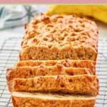 whole wheat banana bread sliced on a wire rack.