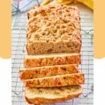 loaf of whole wheat banana bread on a wire rack.