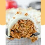 a slice of apple spice cake with cream cheese frosting.