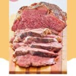 beef tenderloin roast and slices on a wood cutting board.