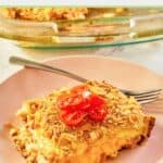 breakfast ham strata with corn flake topping on a plate.