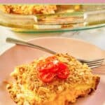 breakfast strata with corn flake topping and a fork on a plate.