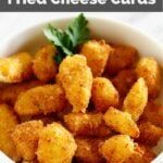 homemade fried cheese curds in a white bowl.