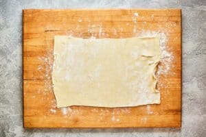 pizza dough rolled out into a rectangle.