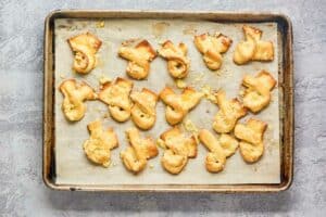 baked garlic bread twists on a baking sheet.