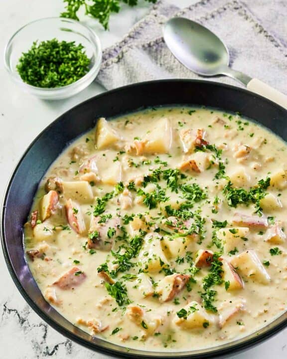 clam chowder in a black bowl.