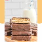 a stack of copycat Girl Scout s'mores cookies on a board.