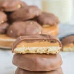 homemade Girl Scout tagalongs cookies in a stack and on a board.