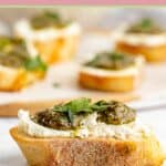 crostini canapes with goat cheese and pesto.