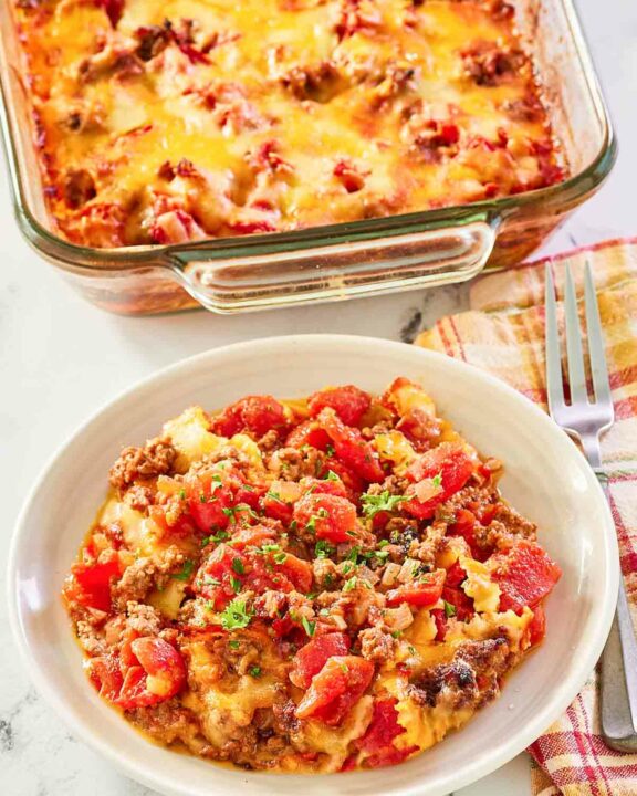 hamburger hash with cheese in a baking dish and bowl.