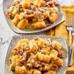 Mexican tater tot casserole on two plates.