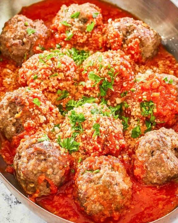 copycat Olive Garden meatballs and marinara in a skillet.