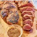 two steaks and a bowl of homemade Outback steak seasoning.