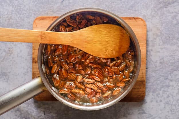 cooking pecan brittle in a pan.