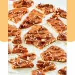 pecan brittle pieces on parchment paper.