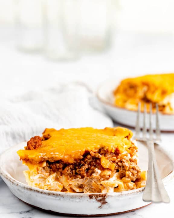 sour cream noodle bake serving and a fork on a plate.