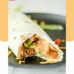 copycat Taco Bell burrito supreme on a black plate.