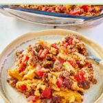 serving of tamale casserole and a fork on a plate.