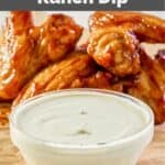 bowl of homemade Wingstop ranch dip and wings behind it.