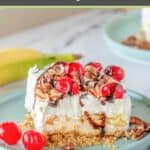 banana split cake topped with maraschino cherries and chopped pecans.