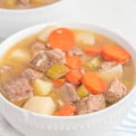 homemade Campbell's vegetable beef soup in two white bowls.