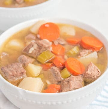 homemade Campbell's vegetable beef soup in two white bowls.