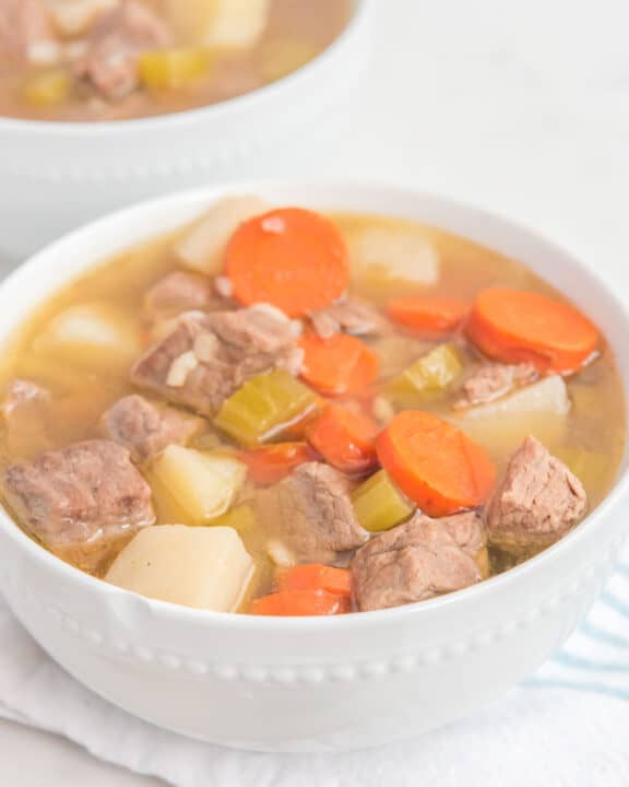 homemade Campbell's vegetable beef soup in two white bowls.