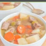 a bowl of homemade Campbell's vegetable beef soup and spoons.