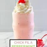 homemade chick fil a peppermint chip milkshake and a bowl of cherries.
