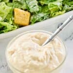 creamy caesar dressing and a caesar salad.