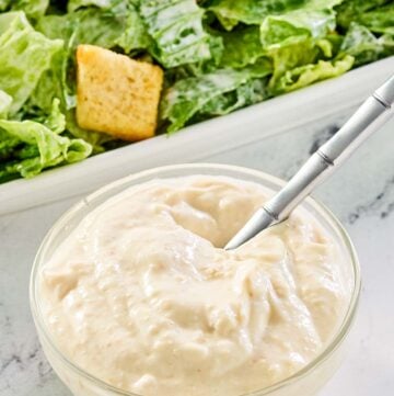 creamy caesar dressing and a caesar salad.