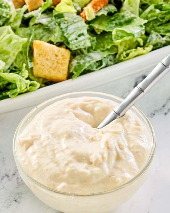 creamy caesar dressing and a caesar salad.