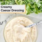 overhead view of a small bowl of creamy caesar salad dressing.