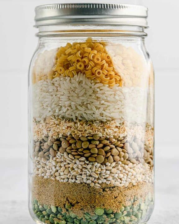 dry friendship soup mix ingredients layered in a jar.