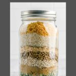 friendship soup ingredients layered in a mason jar.