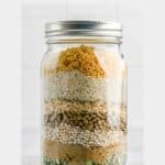 layers of friendship soup ingredients in a jar.