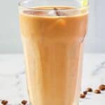 homemade McDonald's iced coffee with a yellow straw.