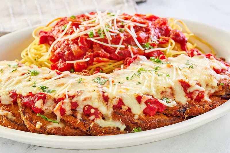 copycat Olive Garden eggplant parmigiana topped with marinara and mozzarella cheese.