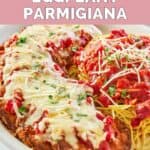homemade Olive Garden eggplant parmesan, pasta, and marinara on a plate.