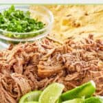 shredded pork shoulder, lime wedges, tortillas, and cilantro.