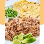 shredded pork shoulder and tortillas on a platter.