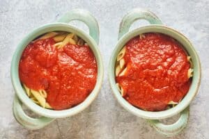 pasta and sauce in bowls.