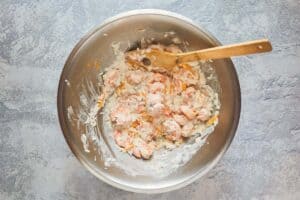 shrimp, cheese, and mushroom soup mixture in a bowl.