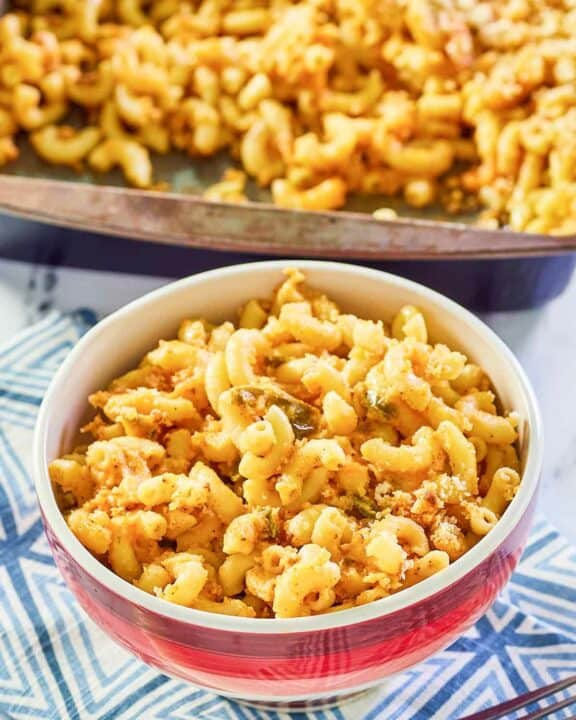 spicy mac and cheese in a bowl and baking dish.