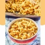 spicy macaroni and cheese in a bowl and baking dish.