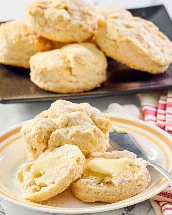 sweet biscuits on a white plate and black platter.