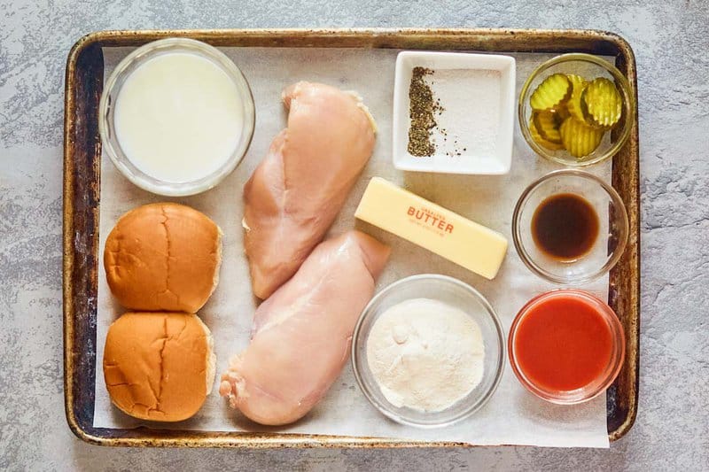 wingstop buffalo chicken sandwich ingredients on a tray.